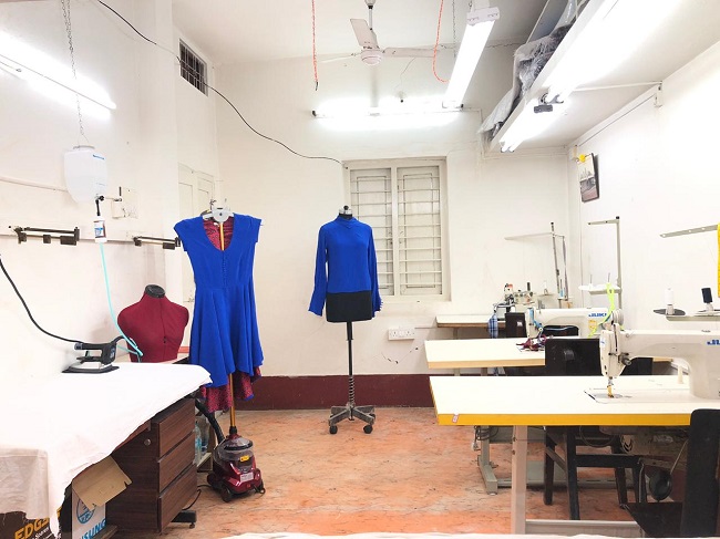 Finishing and tailoring in the House of Kamal garment studio